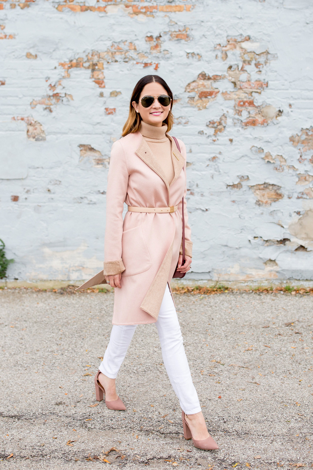 Jennifer Lake Style Charade walking in a Cuyana cashmere coat, belt, turtleneck, and Steve Madden Pamperd pumps in Chicago